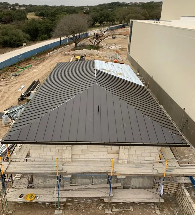 Metal roof new construction with scaffolding in Coral Hills